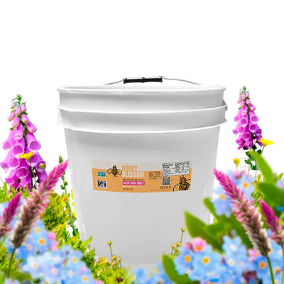 Bucket of 12 lb, with wildflowers around it