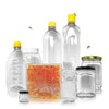 Bottles, jars and a boxed honeycomb, with bees flying between them